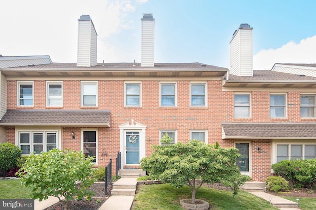 3920 Seneca Ct, Skippack, PA 19474 - view of property with brick siding and a chimney
