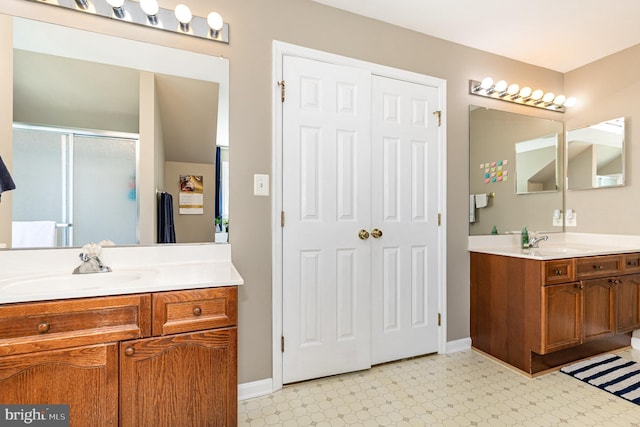 6 Oxen Ct, Stafford, VA 22554 - bathroom with tile patterned floors, two vanities, and a stall shower