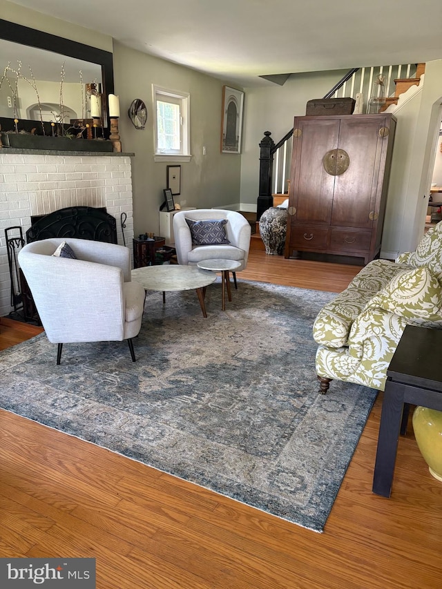 1147 Jericho Rd, Abington, PA 19001 - living area featuring stairs, wood finished floors, and a fireplace