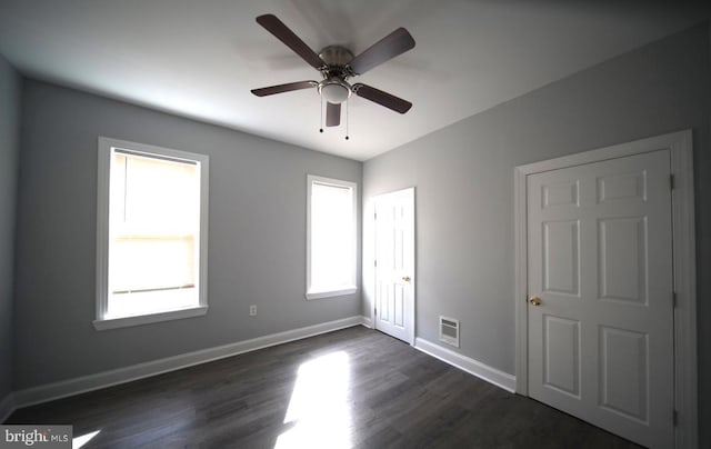 3124 N Carlisle St, Philadelphia, PA 19132 - unfurnished bedroom with dark wood finished floors and a ceiling fan