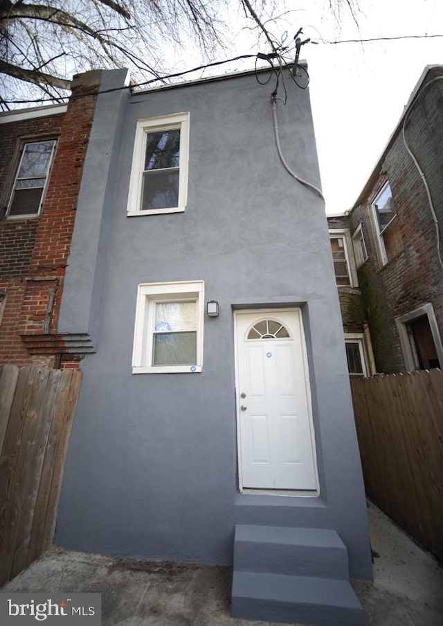 3124 N Carlisle St, Philadelphia, PA 19132 - view of front of home with stucco siding and entry steps