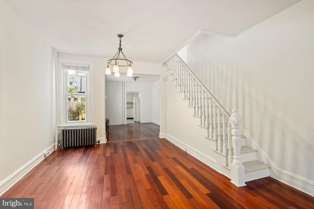 1615 S 16th St, Philadelphia, PA 19145 - unfurnished dining area with radiator, stairs, and hardwood / wood-style flooring