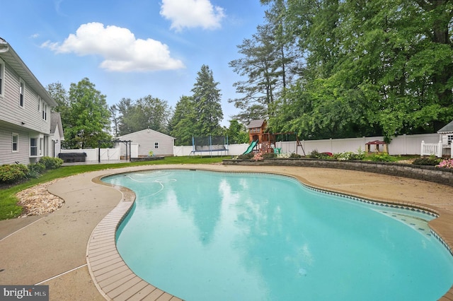 4009 Gypsum Hill Rd, Haymarket, VA 20169 - view of pool featuring a trampoline, a playground, and a fenced backyard