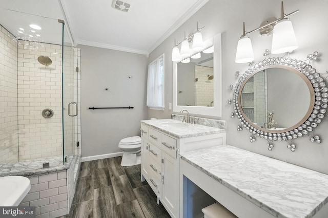 4009 Gypsum Hill Rd, Haymarket, VA 20169 - bathroom with ornamental molding, wood finished floors, a shower stall, and vanity