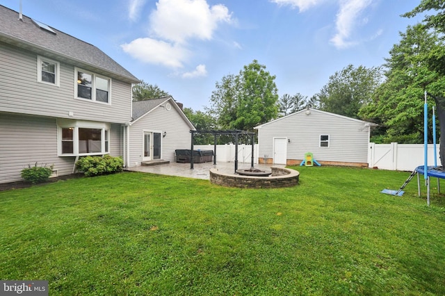 4009 Gypsum Hill Rd, Haymarket, VA 20169 - fenced backyard with a trampoline, a patio, a fire pit, and a pergola