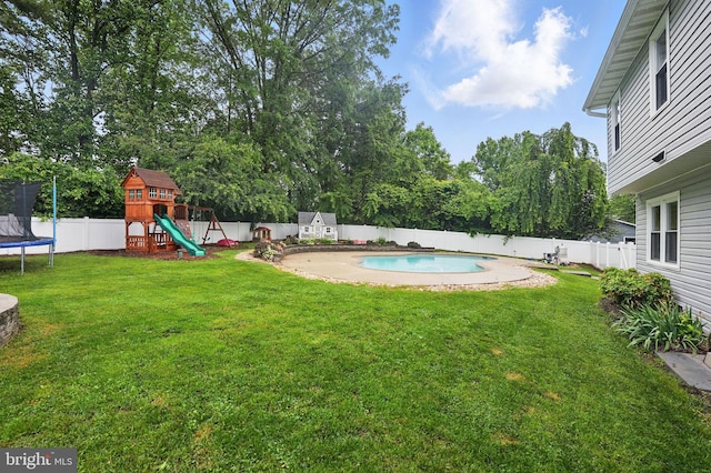 4009 Gypsum Hill Rd, Haymarket, VA 20169 - fenced backyard with a trampoline, a playground, and view of scattered trees