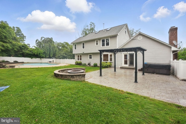 4009 Gypsum Hill Rd, Haymarket, VA 20169 - rear view of property featuring a hot tub, a fire pit, a fenced backyard, a pergola, and a patio area