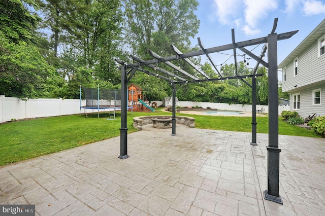 4009 Gypsum Hill Rd, Haymarket, VA 20169 - fenced backyard with a playground, a trampoline, and a patio area
