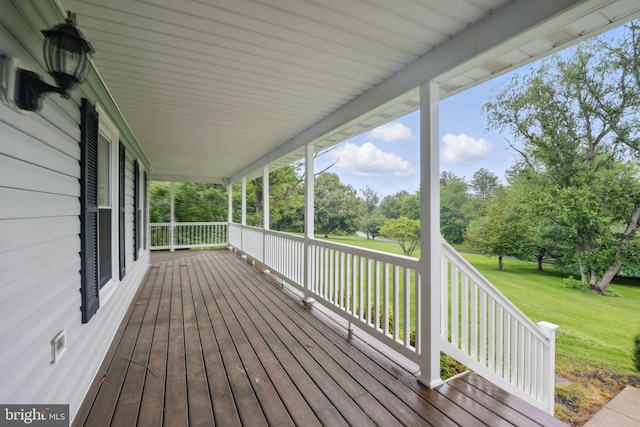4009 Gypsum Hill Rd, Haymarket, VA 20169 - wooden porch featuring a yard and view of wooded area