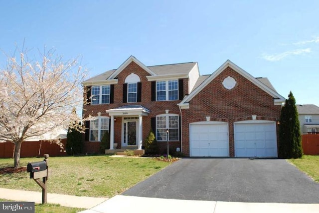 3599 Wanda Ct, Woodbridge, VA 22193 - view of front facade with asphalt driveway, an attached garage, and brick siding
