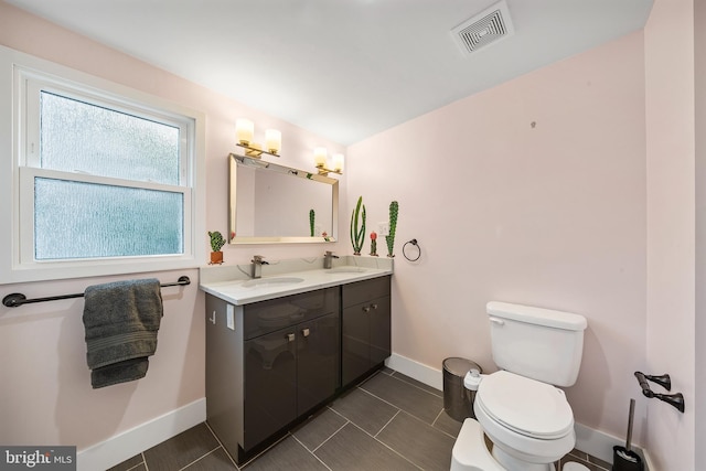 2230 Watkins St, Philadelphia, PA 19145 - bathroom featuring double vanity and baseboards