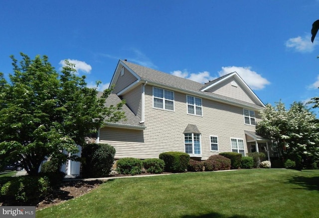 907 Country Ln, Morgantown, PA 19543 - view of front of house with a front lawn and a shingled roof
