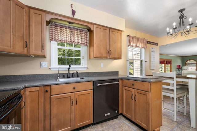 1559 Washington Ln, West Chester, PA 19382 - kitchen featuring dishwashing machine, dark countertops, plenty of natural light, and brown cabinetry