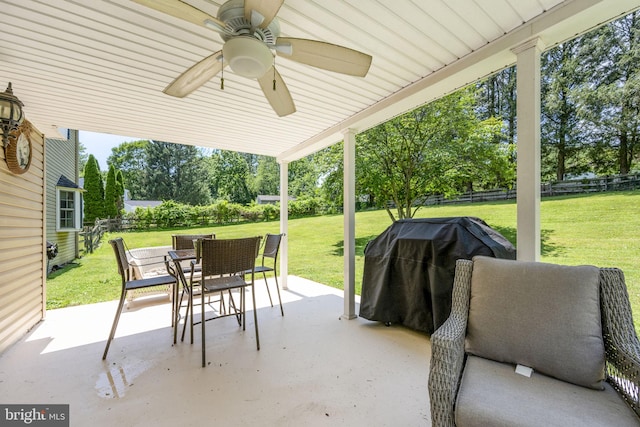 1559 Washington Ln, West Chester, PA 19382 - fenced backyard with outdoor dining area, a grill, a patio, a ceiling fan, and view of scattered trees