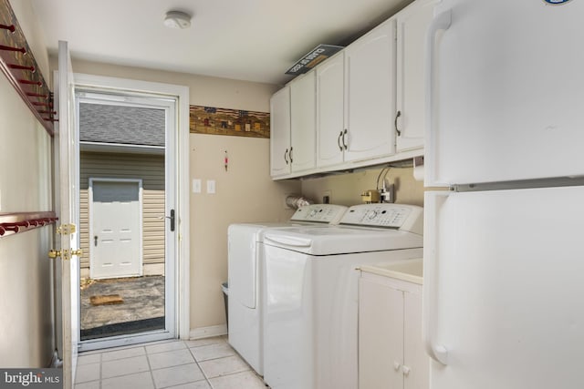 1559 Washington Ln, West Chester, PA 19382 - washroom featuring washing machine and clothes dryer, cabinet space, and light tile patterned flooring