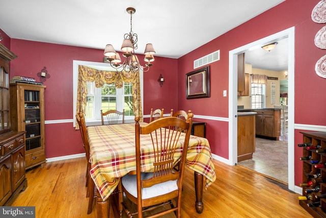 1559 Washington Ln, West Chester, PA 19382 - dining room featuring a chandelier, light wood-style floors, and plenty of natural light