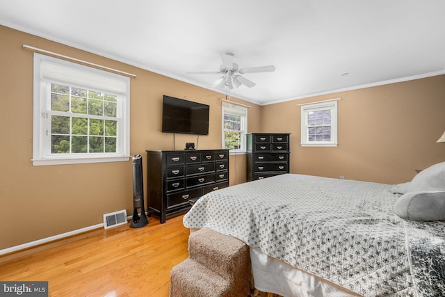 1559 Washington Ln, West Chester, PA 19382 - bedroom featuring crown molding, light wood-style flooring, and a ceiling fan