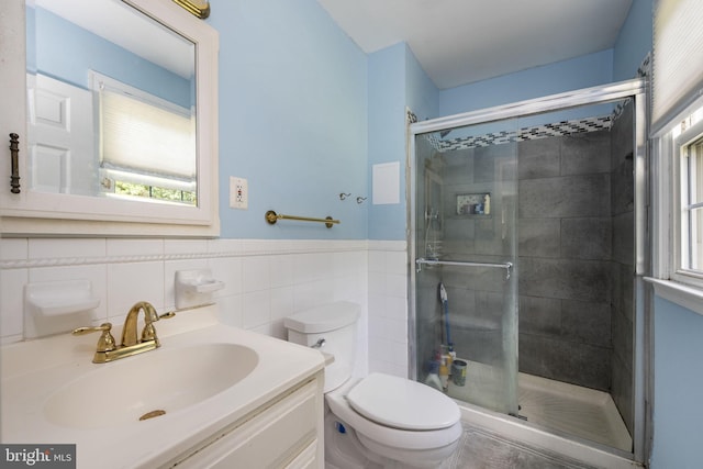 1559 Washington Ln, West Chester, PA 19382 - full bath featuring a stall shower, vanity, tile walls, and wainscoting