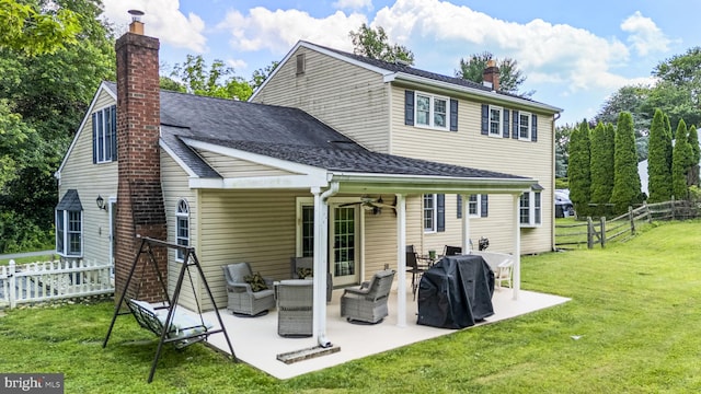 1559 Washington Ln, West Chester, PA 19382 - rear view of house featuring a ceiling fan, a chimney, outdoor lounge area, and a fenced backyard