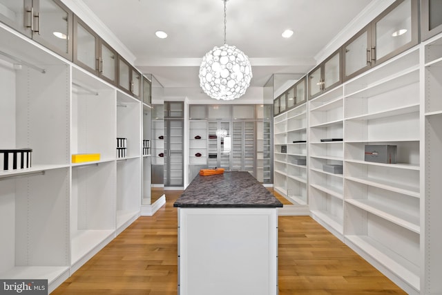130 S 18th St Unit 3102, Philadelphia, PA 19103 - walk in closet with light wood finished floors and a chandelier