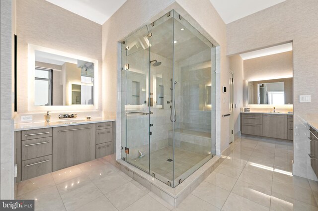 130 S 18th St Unit 3102, Philadelphia, PA 19103 - bathroom with a shower stall, two vanities, and healthy amount of natural light