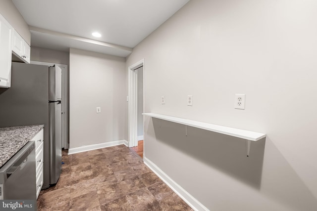838 Benninghaus Rd, Baltimore, MD 21212 - kitchen with stainless steel appliances, white cabinets, stone finish flooring, light countertops, and recessed lighting