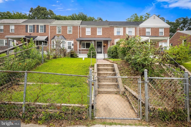 838 Benninghaus Rd, Baltimore, MD 21212 - townhome / multi-family property with a gate and brick siding