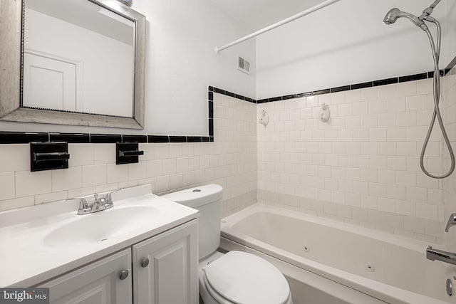 838 Benninghaus Rd, Baltimore, MD 21212 - full bath featuring a combined bath / shower with jetted tub, vanity, and tile walls