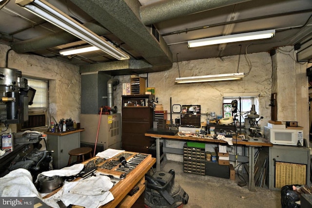1806 Graham Ln, Elkins Park, PA 19027 - miscellaneous room featuring a workshop area, concrete flooring, and heating unit