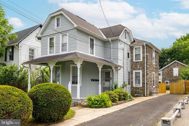 1806 Graham Ln, Elkins Park, PA 19027 - view of front of property with stone siding, a porch, a shingled roof, and a gate