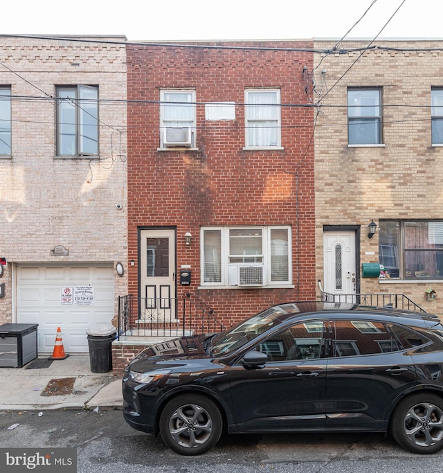 2212 S Bouvier St, Philadelphia, PA 19145 - multi unit property featuring brick siding, an attached garage, and cooling unit