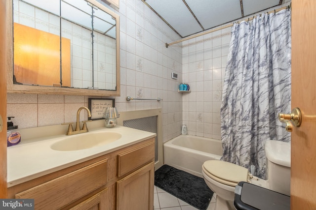 2212 S Bouvier St, Philadelphia, PA 19145 - full bath with shower / bath combo, tile patterned flooring, vanity, tile walls, and decorative backsplash