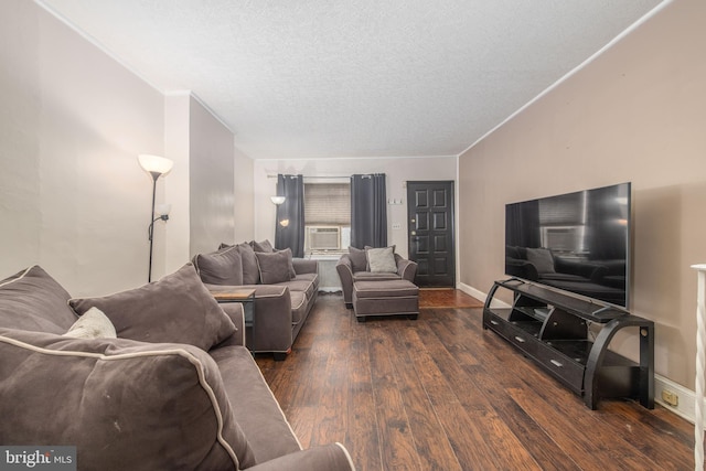2212 S Bouvier St, Philadelphia, PA 19145 - living area with dark wood-style floors, a textured ceiling, cooling unit, and crown molding