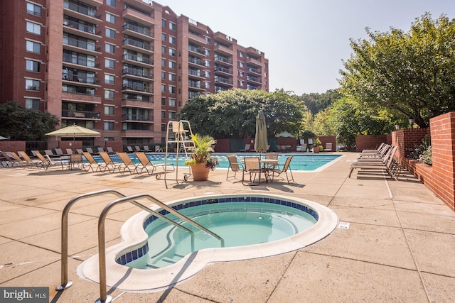 2230 George C Marshall Dr Unit 512, Falls Church, VA 22043 - community pool with a community hot tub and a patio