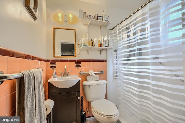 3702 Kingwood Sq, Baltimore, MD 21215 - bathroom featuring tile walls, vanity, a wainscoted wall, and a shower with shower curtain