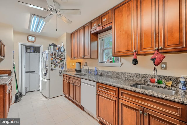 3702 Kingwood Sq, Baltimore, MD 21215 - kitchen with white appliances, ceiling fan, brown cabinetry, and light stone countertops