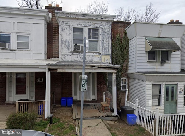 508 E Bringhurst St, Philadelphia, PA 19144 - townhome / multi-family property with a porch, brick siding, and cooling unit