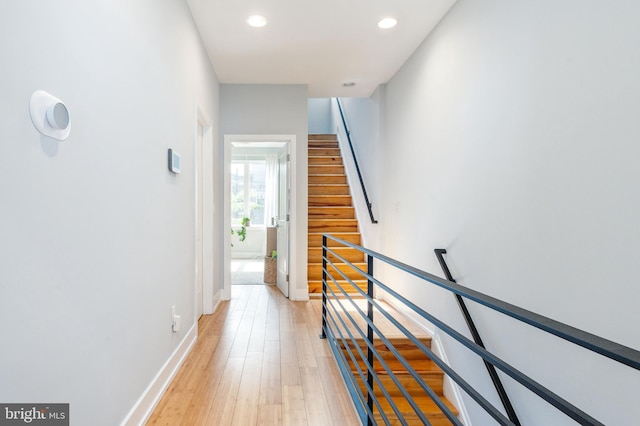 1229 S Bucknell St, Philadelphia, PA 19146 - hallway featuring light wood finished floors, recessed lighting, an upstairs landing, and stairway