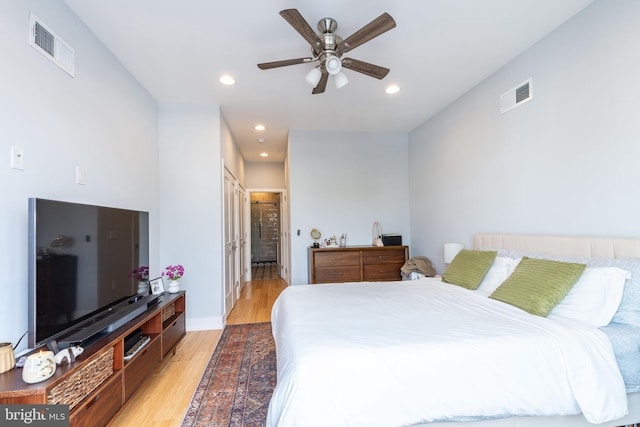 1229 S Bucknell St, Philadelphia, PA 19146 - bedroom with light wood-style flooring, recessed lighting, connected bathroom, and ceiling fan