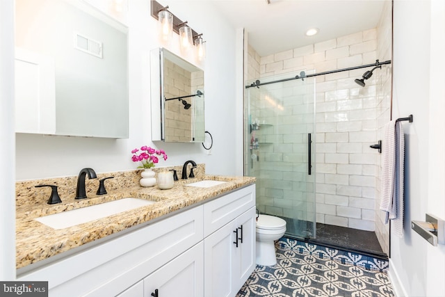 1229 S Bucknell St, Philadelphia, PA 19146 - full bathroom featuring a shower stall, double vanity, and recessed lighting