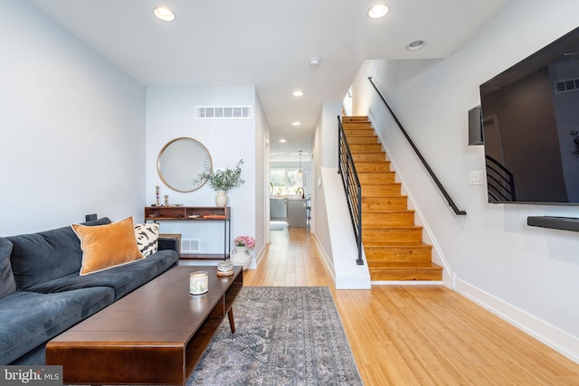 1229 S Bucknell St, Philadelphia, PA 19146 - living area featuring wood finished floors, stairway, and recessed lighting