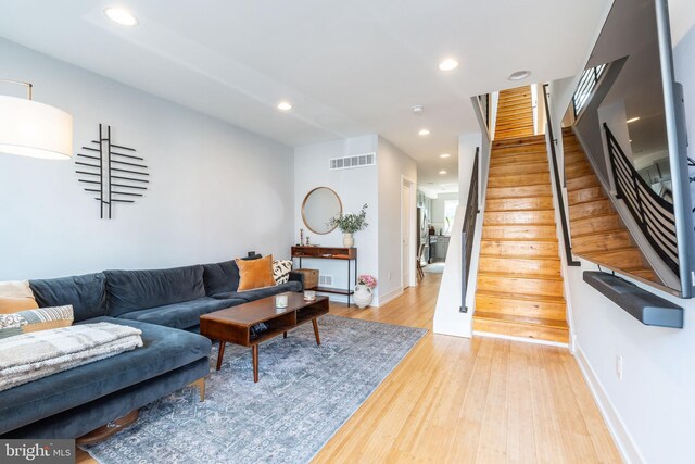 1229 S Bucknell St, Philadelphia, PA 19146 - living area with stairs, recessed lighting, and light wood finished floors