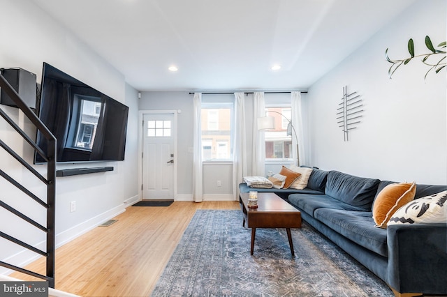 1229 S Bucknell St, Philadelphia, PA 19146 - living room featuring wood finished floors, stairway, and recessed lighting