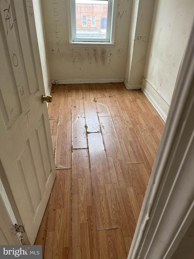 3601 9th St, Baltimore, MD 21225 - unfurnished room with light wood-type flooring and baseboards