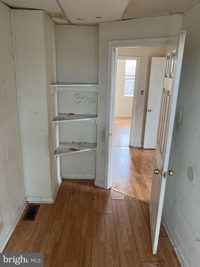 3601 9th St, Baltimore, MD 21225 - hallway with wood finished floors and a drop ceiling