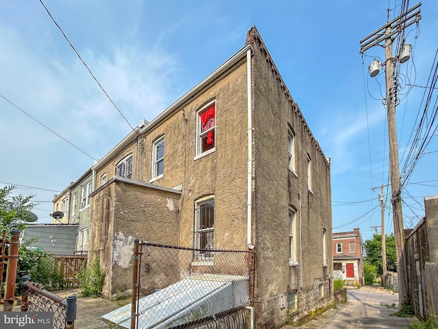3601 9th St, Baltimore, MD 21225 - back of house featuring stucco siding