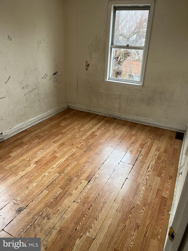 3601 9th St, Baltimore, MD 21225 - empty room with hardwood / wood-style floors