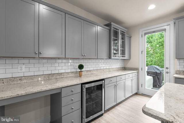 1210 Hickory Hill Cir, Arnold, MD 21012 - kitchen with beverage cooler, backsplash, gray cabinets, light wood-style flooring, and recessed lighting