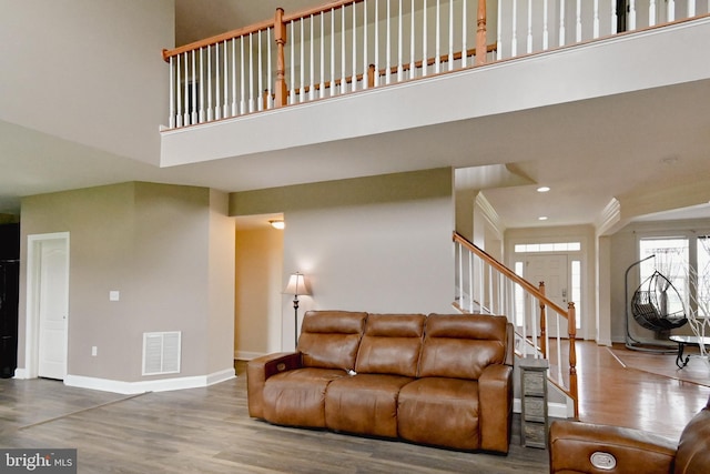 223 Fitzgerald St, Gerrardstown, WV 25420 - living area featuring a high ceiling, wood finished floors, and stairway