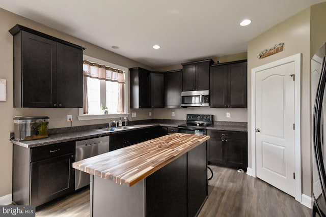 223 Fitzgerald St, Gerrardstown, WV 25420 - kitchen featuring appliances with stainless steel finishes, butcher block counters, wood finished floors, dark cabinetry, and recessed lighting